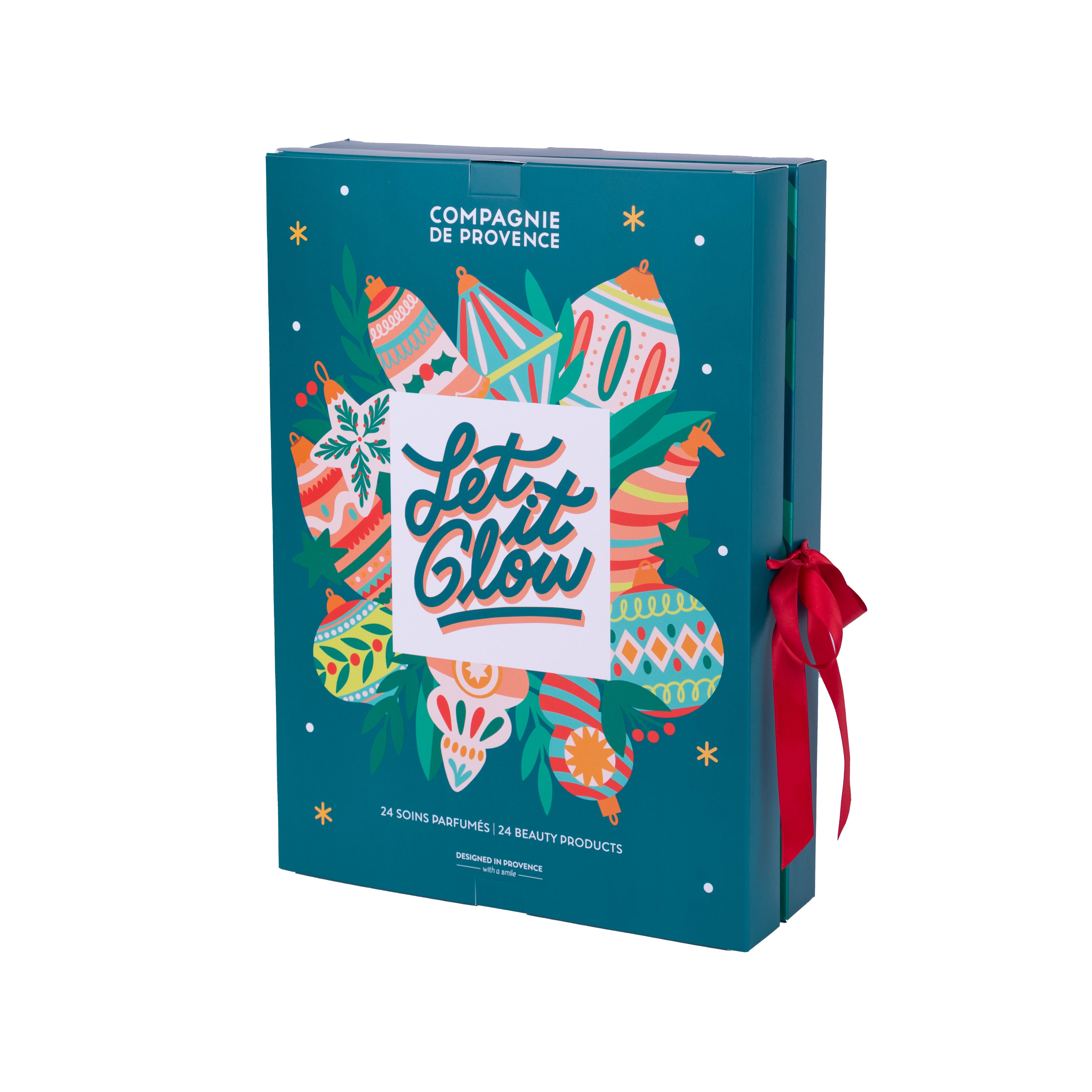 Ein Adventskalender von Compagnie de Provence mit der Aufschrift 'Let it Glow' und bunten Ornamenten, verziert mit einer roten Schleife.